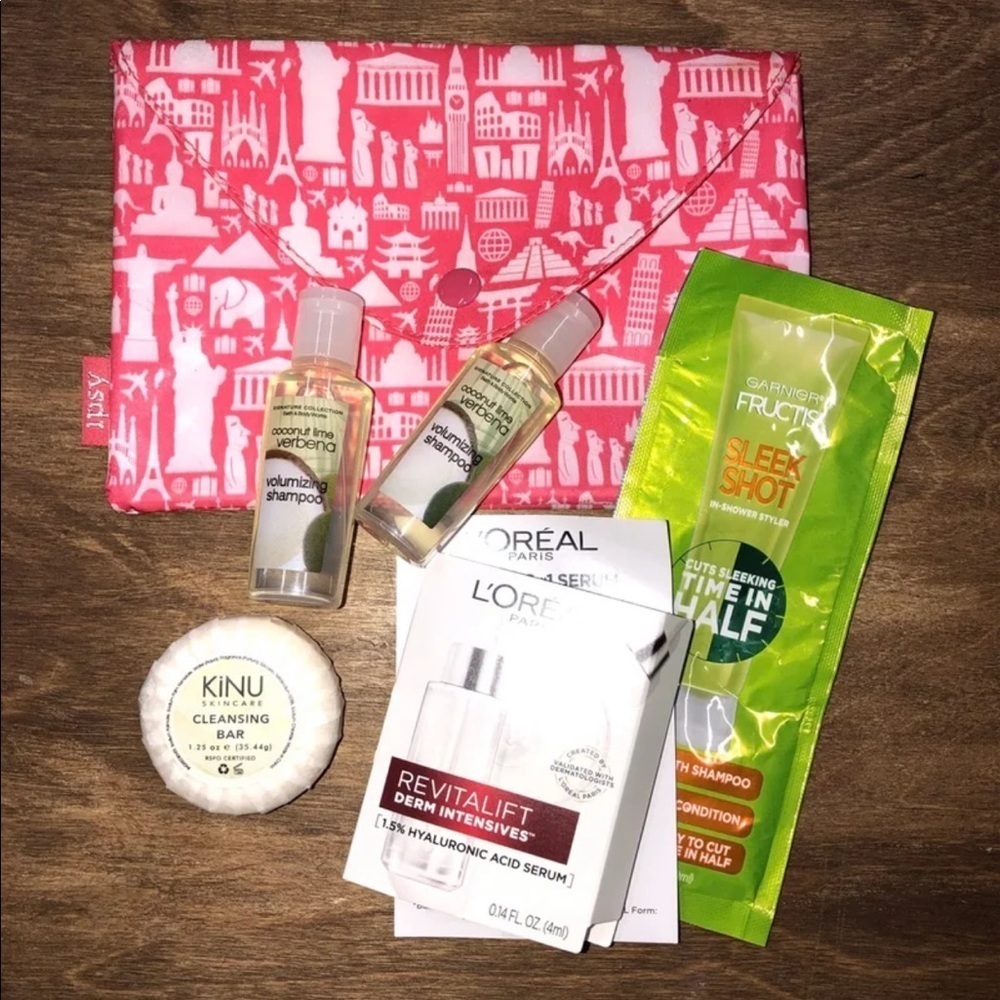 Ipsy pink travel bag with toiletries